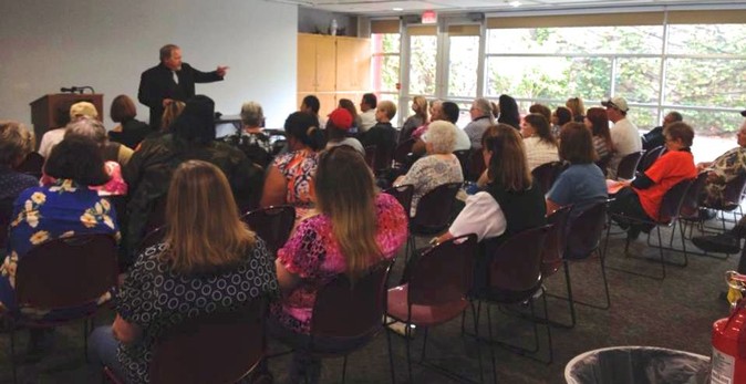 Edward Shanahan speaking to a group of people about the Supernatural
